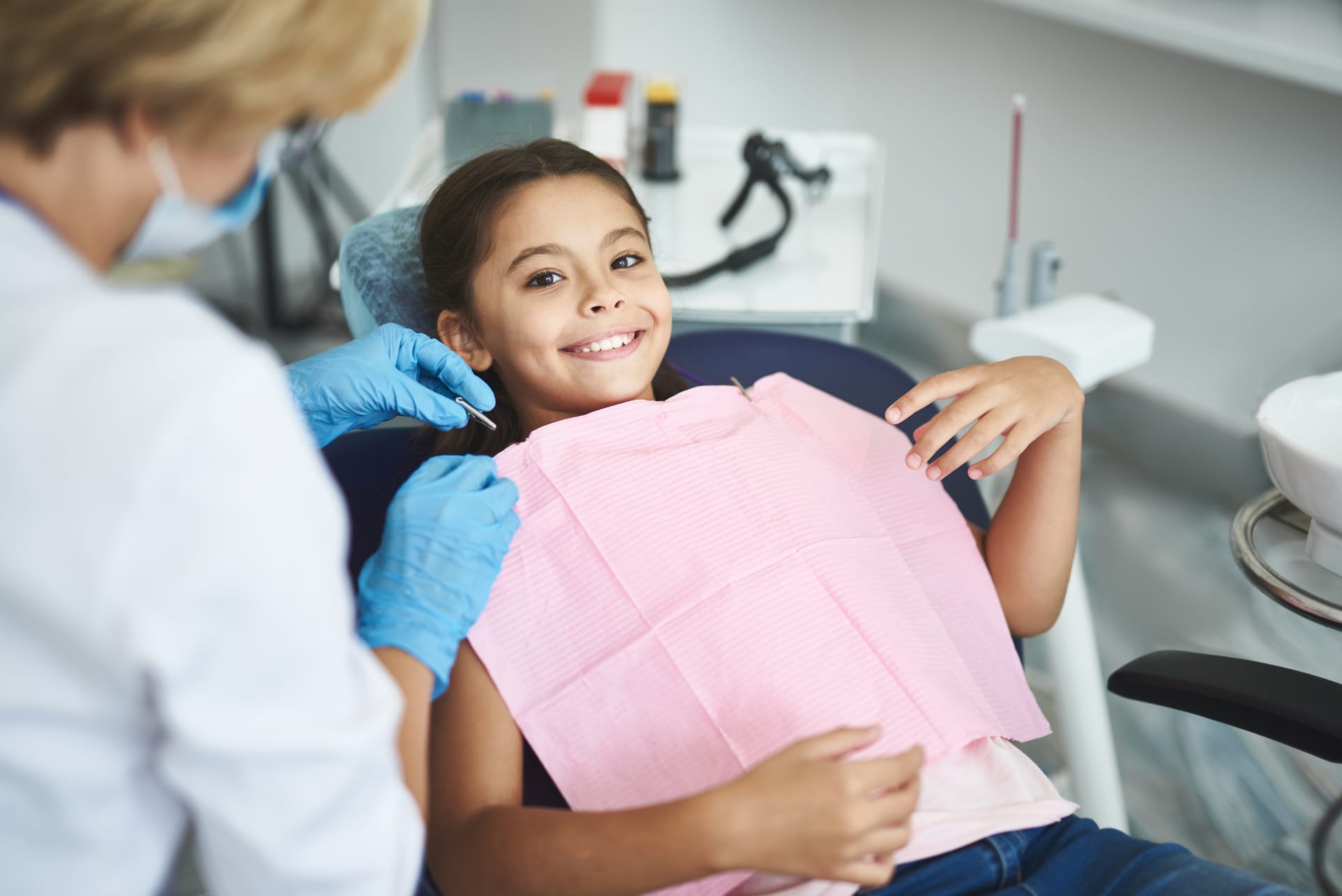 Teens receiving dental counseling and home care hygiene guidance