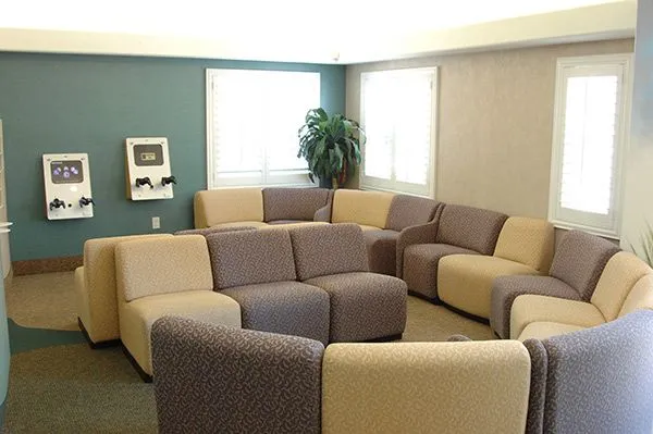 Bright and inviting children's waiting lounge with comfortable seating