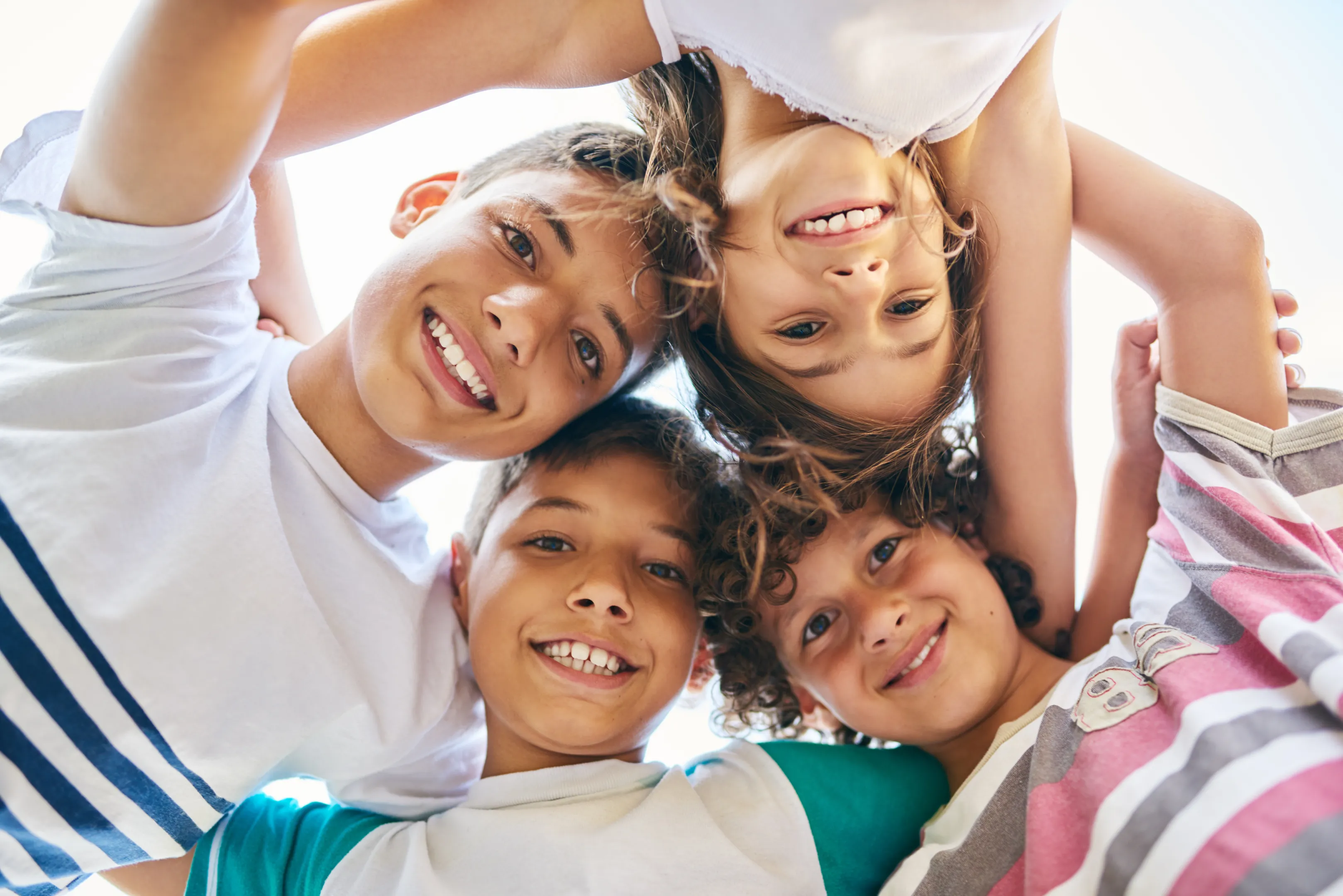 Teen smiling confidently after cosmetic dental care in New Tampa, FL